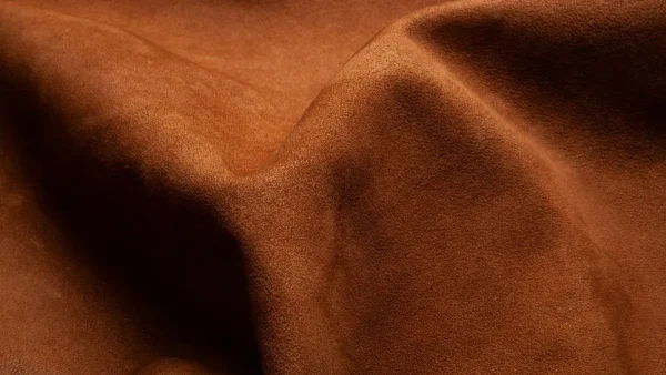 LG Shoes - Footwear AW 2027/28 trends: what brands should consider before development starts 5 Warm brown suede texture illustrating tactile material directions for AW 2027/28 footwear trends