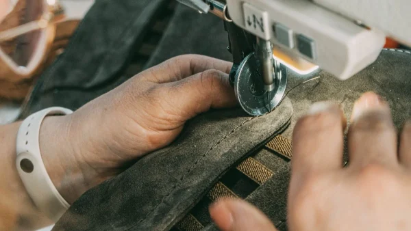 LG Shoes - Footwear production briefing checklist: what brands must define before production 5 Footwear stitching process showing construction quality and technical precision in shoe manufacturing