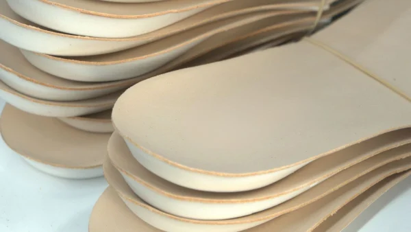 LG Shoes - MOQ in footwear manufacturing: what brands need to know before production 3 Footwear MOQ material sourcing with sole components in production