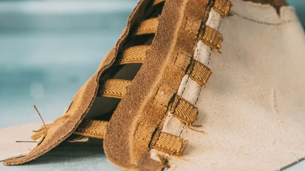 Upper construction detail affecting footwear pricing in Europe