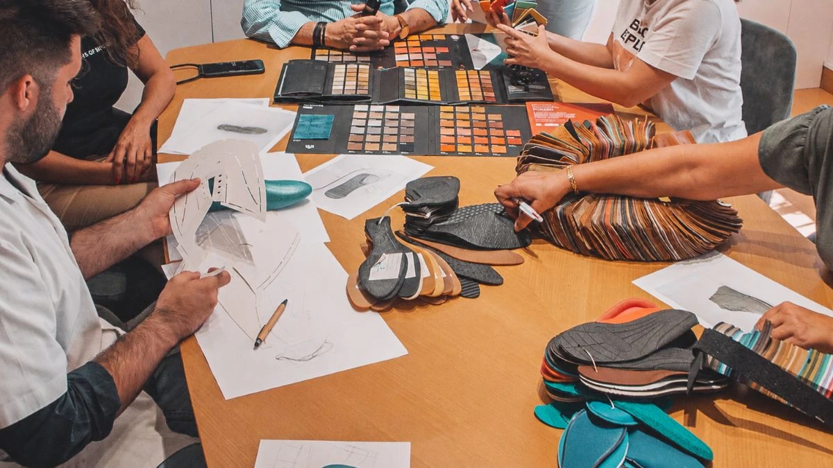 footwear production briefing with materials, sketches and shoe componentes