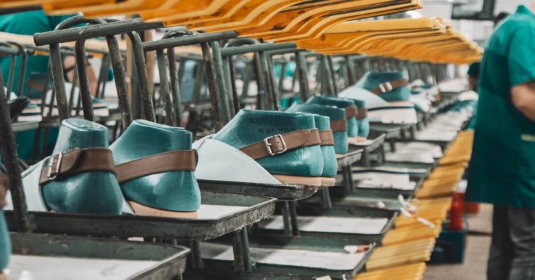 Footwear production process in a Portuguese shoe manufacturer with shoe lasting on production line