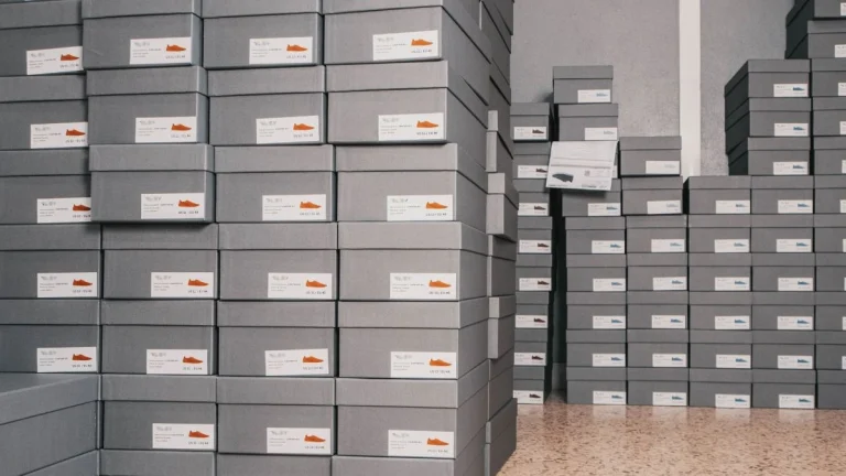 Stacks of labelled shoe boxes illustrating footwear traceability and product documentation in Europe