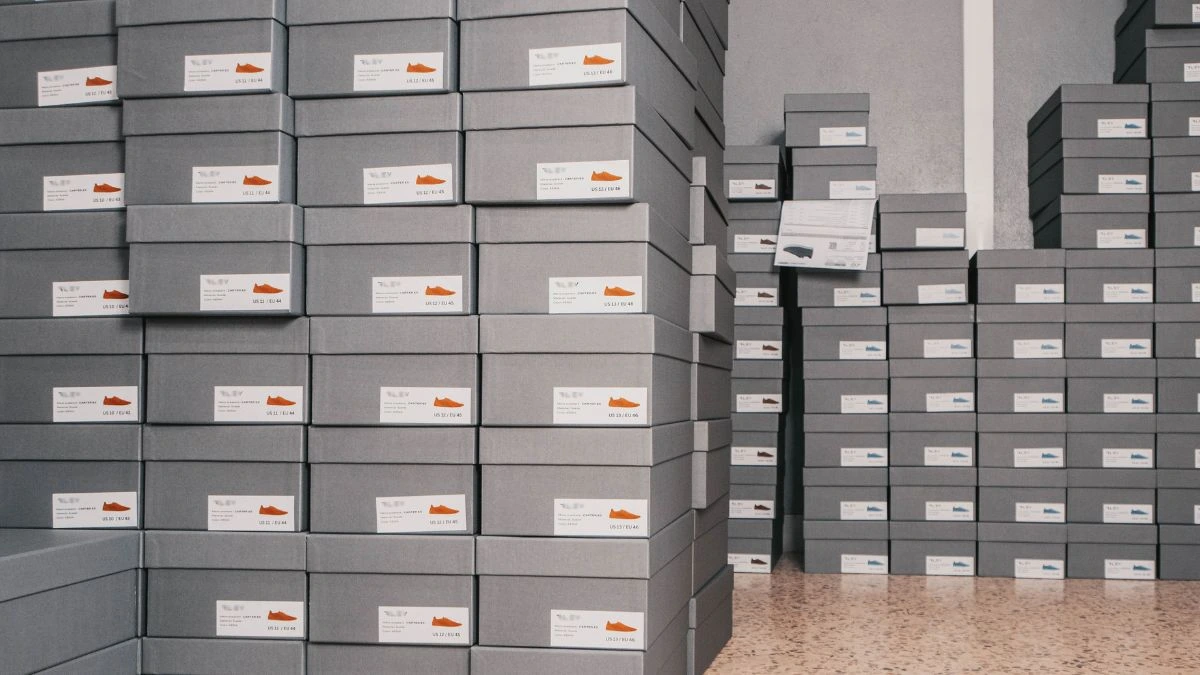 Stacks of labelled shoe boxes illustrating footwear traceability and product documentation in Europe