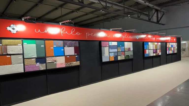 Material sourcing display at Lineapelle trade fair where brands evaluate a European footwear manufacturer and textile suppliers
