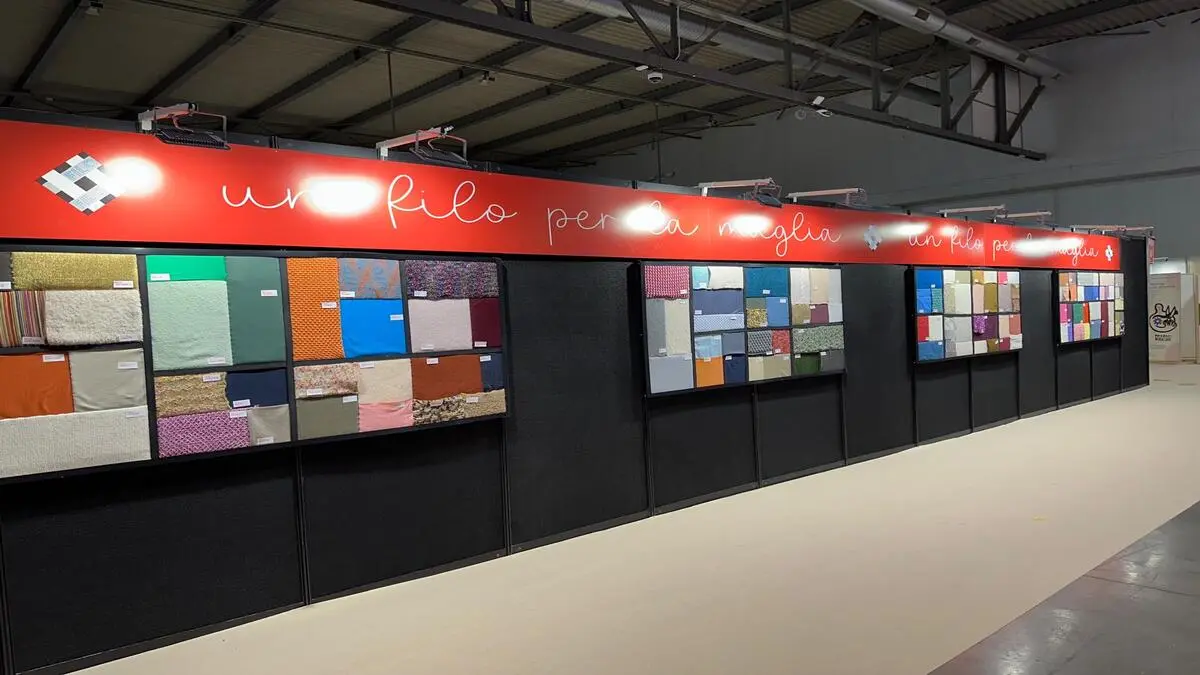 Material sourcing display at Lineapelle trade fair where brands evaluate a European footwear manufacturer and textile suppliers